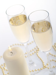 Two champagne glasses on the grey background