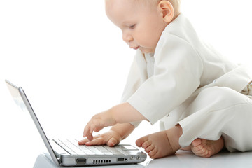 Naklejka premium Baby with laptop