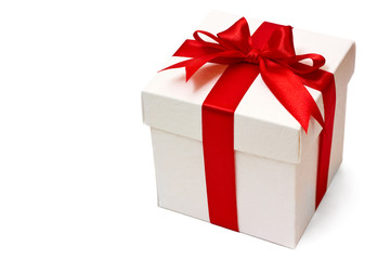 white gift box with a red ribbon and bow isolated over white