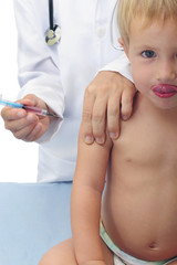 Vaccination: doctor injecting baby