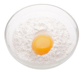 heap white meal with egg yolk in glass cup