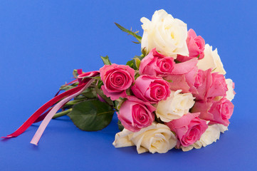 Bouquet roses on blue