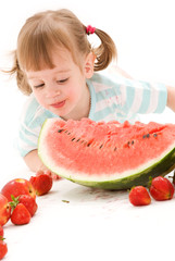 little girl with strawberry and watermelon