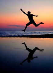 Silhouette running men on sundown