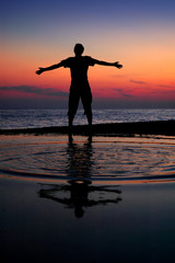 Silhouette standing men on sundown