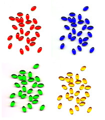 Red, blue, green and yellow gel caps white background.