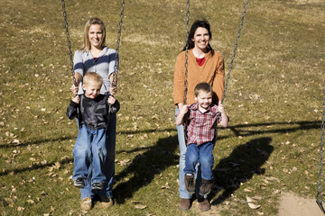 mothers and sons on swing