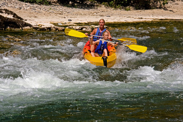 Two people in canoe enjoying holidays