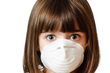 Worried girl wearing a particle mask