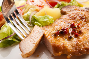 Grilled meat with boiled potatoes and vegetable salad