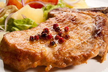 Grilled meat with boiled potatoes and vegetable salad
