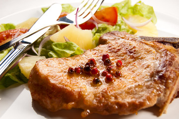 Grilled meat with boiled potatoes and vegetable salad
