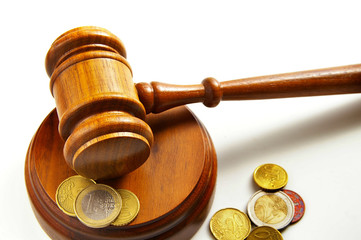 assorted euro coins and a court gavel