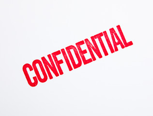 Red confidential stamp on white