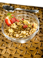 musli with strawberry on a wooden cover