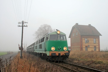 Obraz premium Passenger train passing through countryside