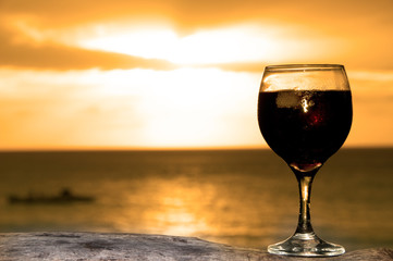 Glass of wine on the beach