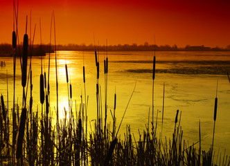 winter lake in sunset