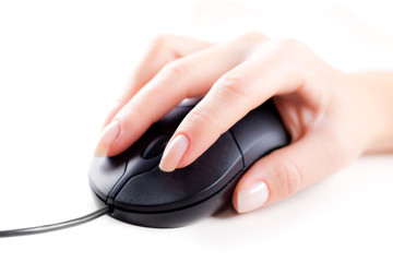 Female hand on computer mouse