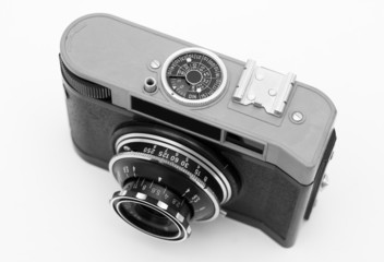 Old antique analog photo camera isolated on white
