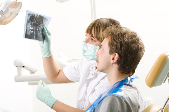 Caring dentist - examining radiography