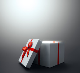 White gift with a red ribbon - christmas celebration image