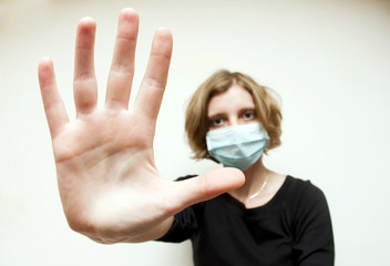 Woman with medical mask protecting against swine flu