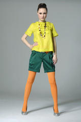 fashion model posing at gray background