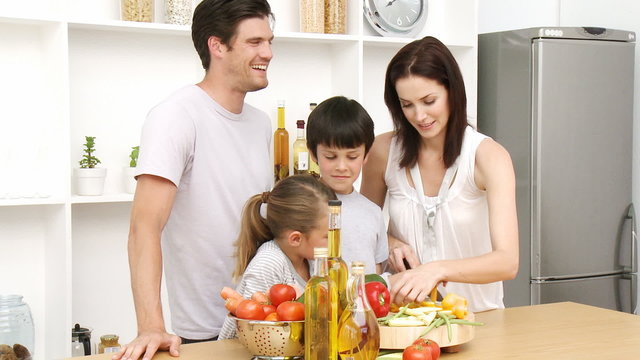 Young Family at home Preparing Food