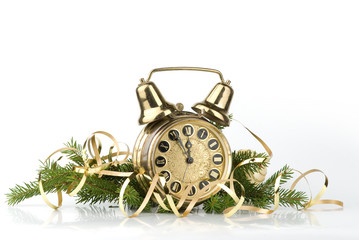 New Year concept. Alarm clock and conifer branch
