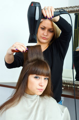 hair stylist with hair blower