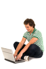 Casual guy sitting with laptop