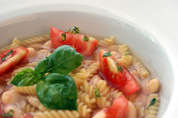 mediterranean noodle soup with white beans and tomato