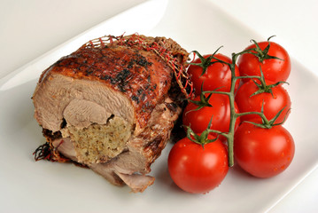 grilled organic stuffed turkey leg on a plate