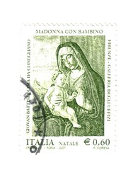 Fototapeta na wymiar italian post stamp: Madonna (Mary) with children