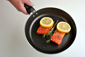organic wild salmon steak in a pan