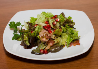 Warm salad with bacon and pomegranate