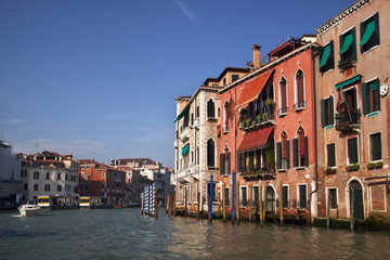 Fototapeta na wymiar Grand Canal Boat Reflections Poles Venice Italy