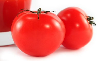 tomatoes and a glass of tomato juice isolated