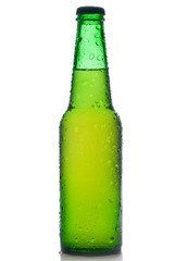 Green beer bottle with water drops isolated on white