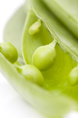 fresh peas on white background