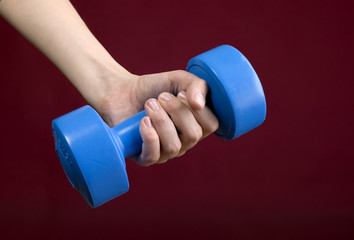 Human hand and dumbbell