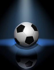 Naklejka premium soccer ball in blue spotlight