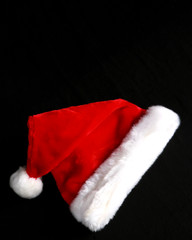 Santa hat on black with copy space