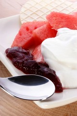 melon with cream fresh and almond slivers and wafer