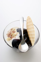 blueberry jelly with wafer and cream in a bowl