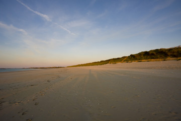 view of a beach before sunset