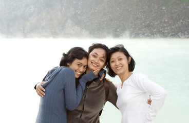 three happy asian sisters