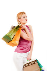 Young sexy shopping girl with lots of colourfull bags
