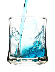 Splash, blue drink is being poured into glass